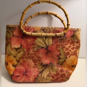 The Scala Collection 100% Raffia floral bag with bamboo style handles.